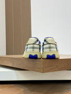 Burberry check sneakers, rear heel with plaid panels and blue rubber heel tab.