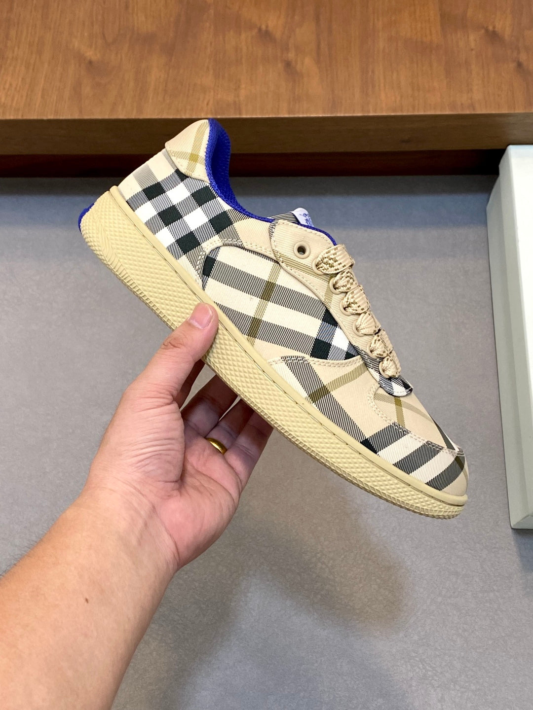 Burberry check sneaker, beige plaid side panel with blue tongue and lace-up closure.