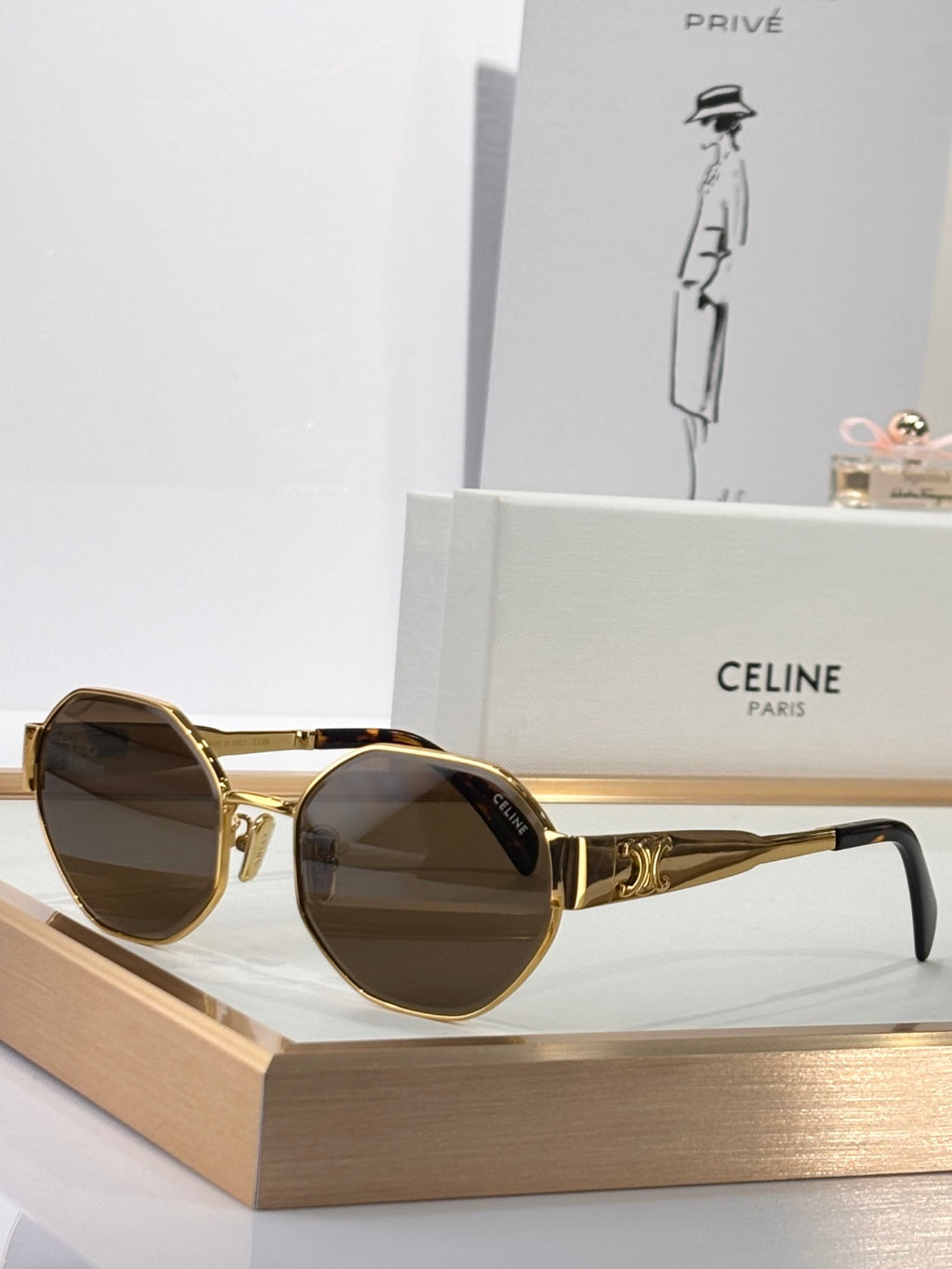 Celine sunglasses with gold round frames and dark tinted lenses