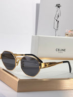 Celine sunglasses with gold round frames and dark tinted lenses