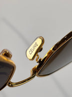 Celine sunglasses close-up: CELINE logo on gold hinge near temple