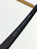 Black eyeglasses temple with printed size and Made in Italy text