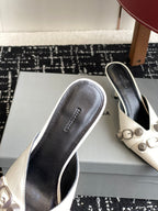 Balenciaga white heeled sandals with black interior and pointed toe