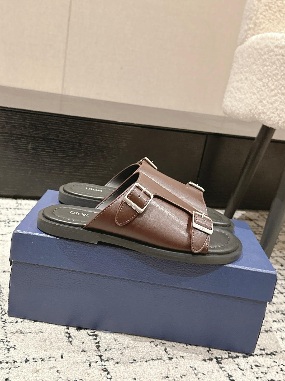 Dior brown leather slide sandals on box, side strap detail with buckle
