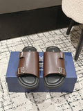 Dior brown leather slide sandals with two buckled straps and cushioned footbed