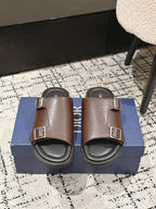 Dior brown leather slide sandals with two buckled straps and cushioned footbed
