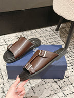 Dior brown leather slide sandals angled view with two adjustable buckle straps