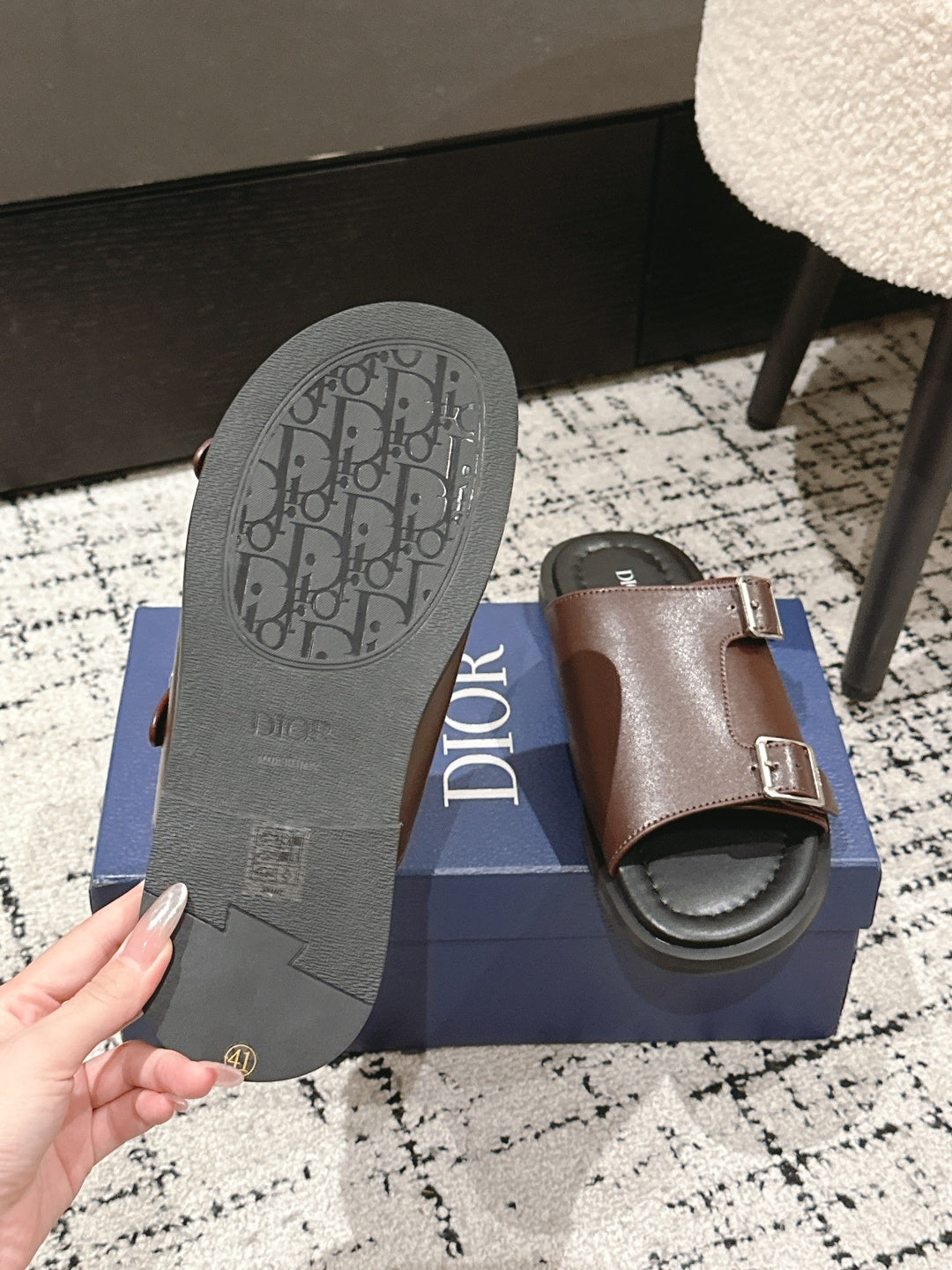 Dior slide sandal outsole and brown upper, showing Dior monogram pattern