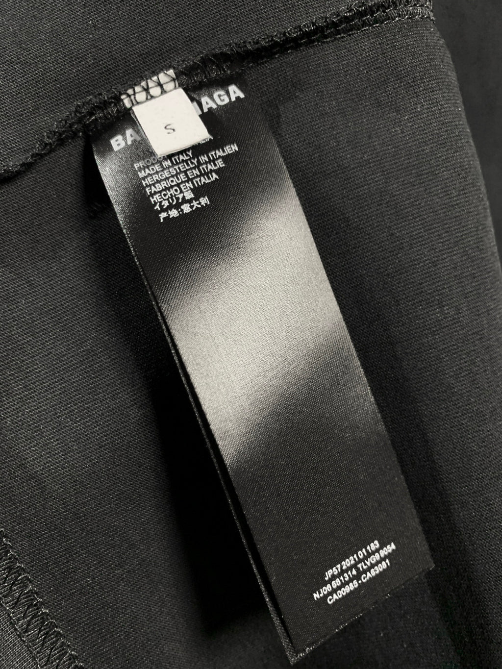 Balenciaga dark T-shirt care label inside neck seam