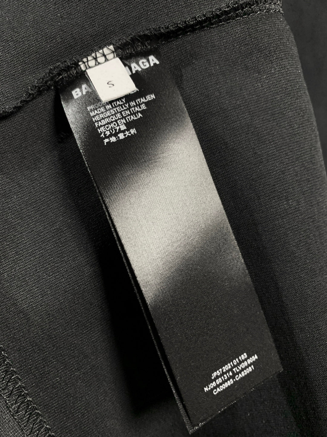 Balenciaga dark T-shirt care label inside neck seam