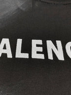 Balenciaga dark T-shirt close-up of large front logo letters
