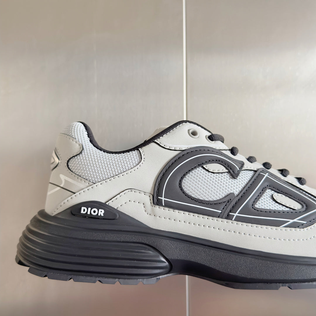 Dior unisex sneaker close side view in white with gray emblem and thick sole