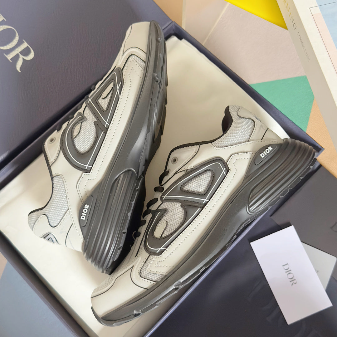 Dior unisex sneakers angled view with panel seams, dark laces, and grippy sole