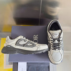 Dior unisex low-top sneakers with textured upper, laces, and gray rubber sole