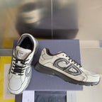 Dior unisex sneakers side view with swoosh-like logo details and gray sole