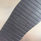 Black Dior sandal outsole with rectangular tread pattern and DIOR logo plate