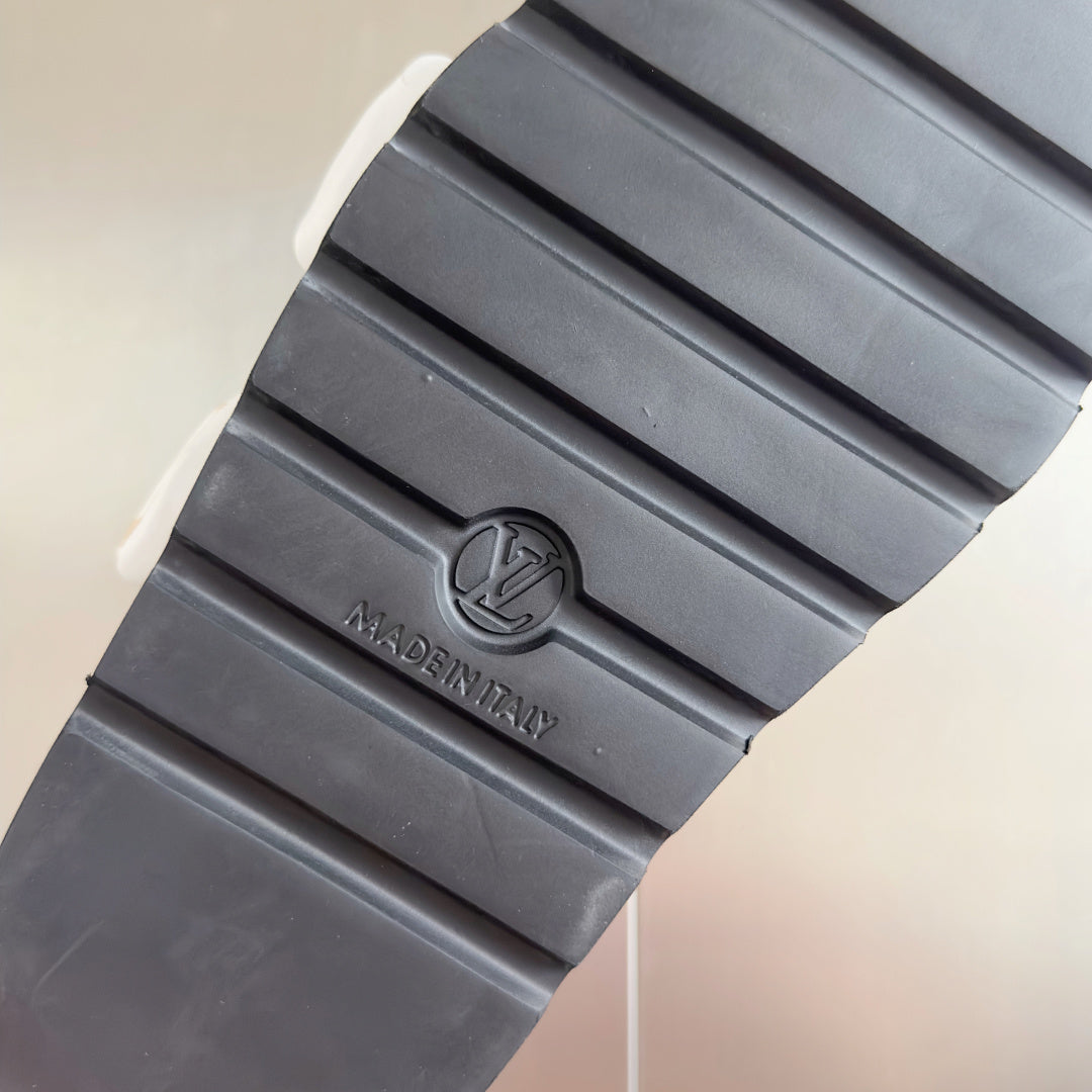 Ridged rubber outsole with LV logo medallion and textured tread