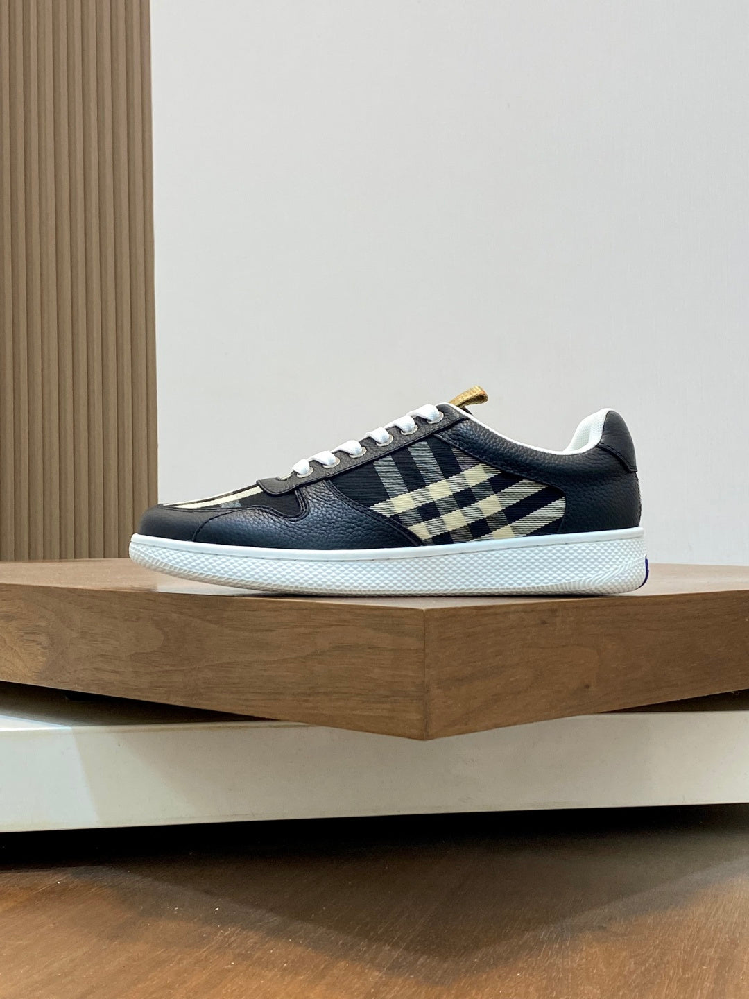 Burberry low-top sneakers, dark upper with check strap and white sole