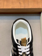 Burberry sneakers close-up, striped tongue and white lace-up front