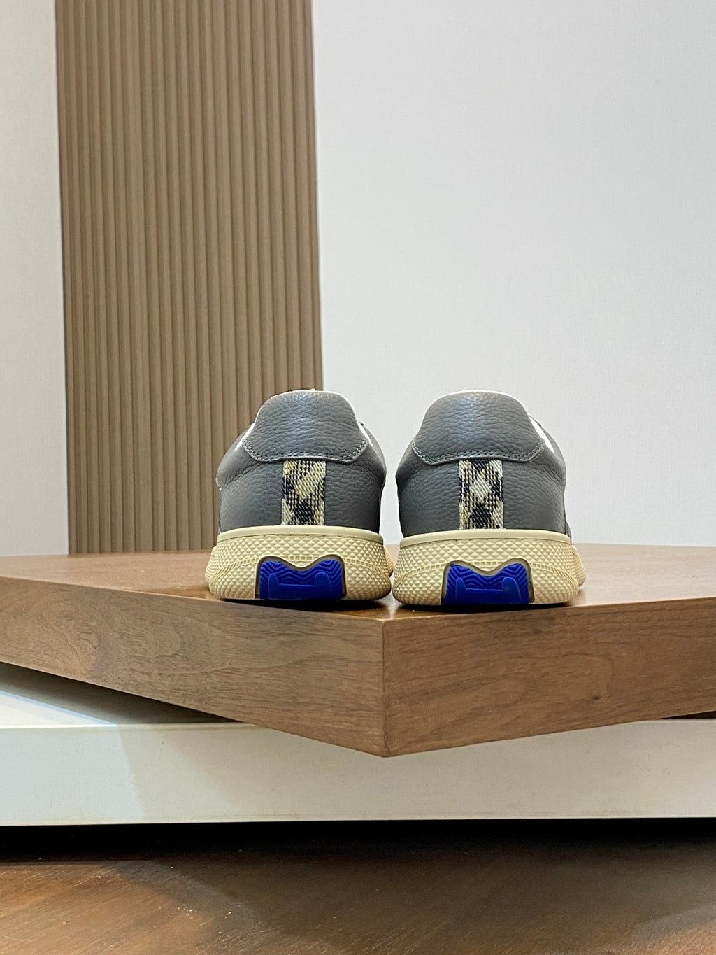 Burberry sneakers from heel, dark gray uppers with blue sole accents