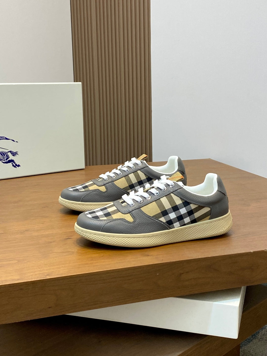 Burberry low-top sneakers in dark gray with beige sole and black-and-tan check trim