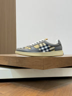 Burberry low-top sneakers, dark gray with yellow sole and checkered stripe panel