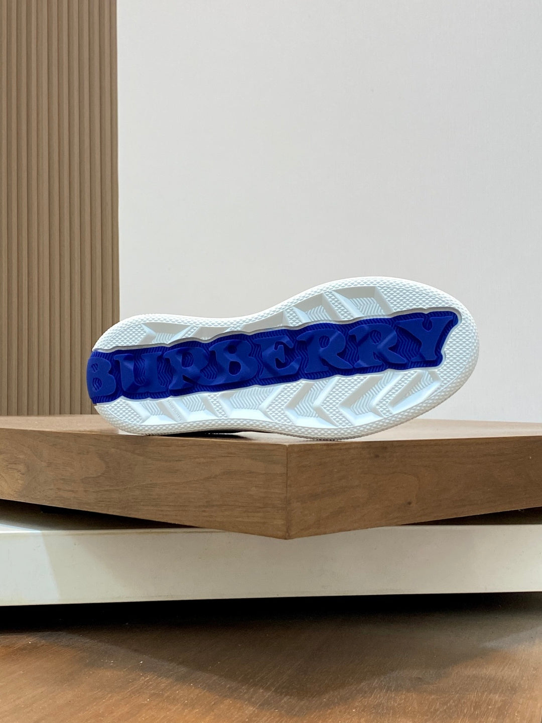Burberry sneakers outsole, textured white rubber with blue logo letters