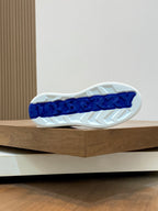 Burberry sneaker outsole, textured white tread with blue lettering