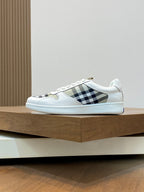 Burberry lace-up sneakers with white uppers and black-and-white check stripe