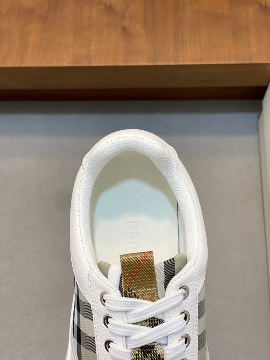 Burberry sneakers with white heel collar and gold label with check panel