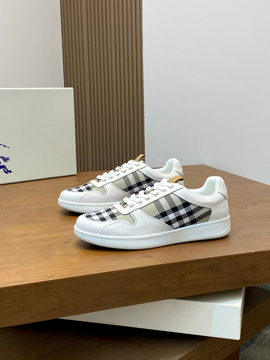 Burberry low-top sneakers with white leather and black check side inserts