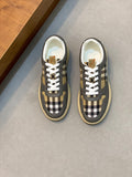 Burberry low-top sneakers in dark gray with tan and black check panels, white laces