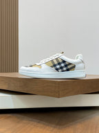 Burberry low-top sneakers with white uppers and black-and-brown check side panel