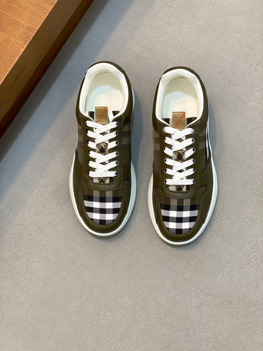 Burberry luxury sneakers in olive green with check panel and white laces