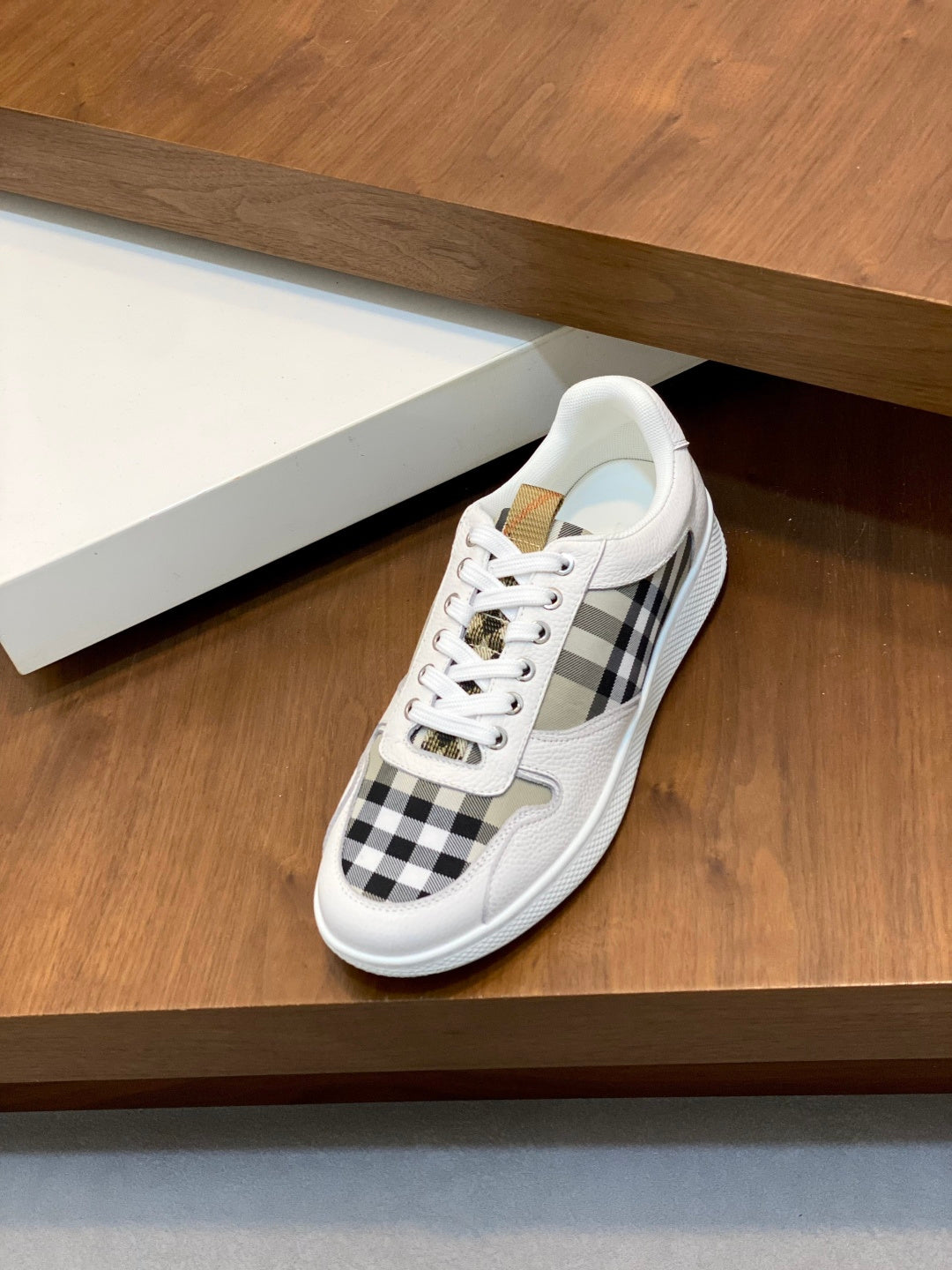 Burberry sneakers with white uppers and black check side panel detail