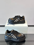 Front and side view of dark navy lace-up sneakers with beige plaid stripe