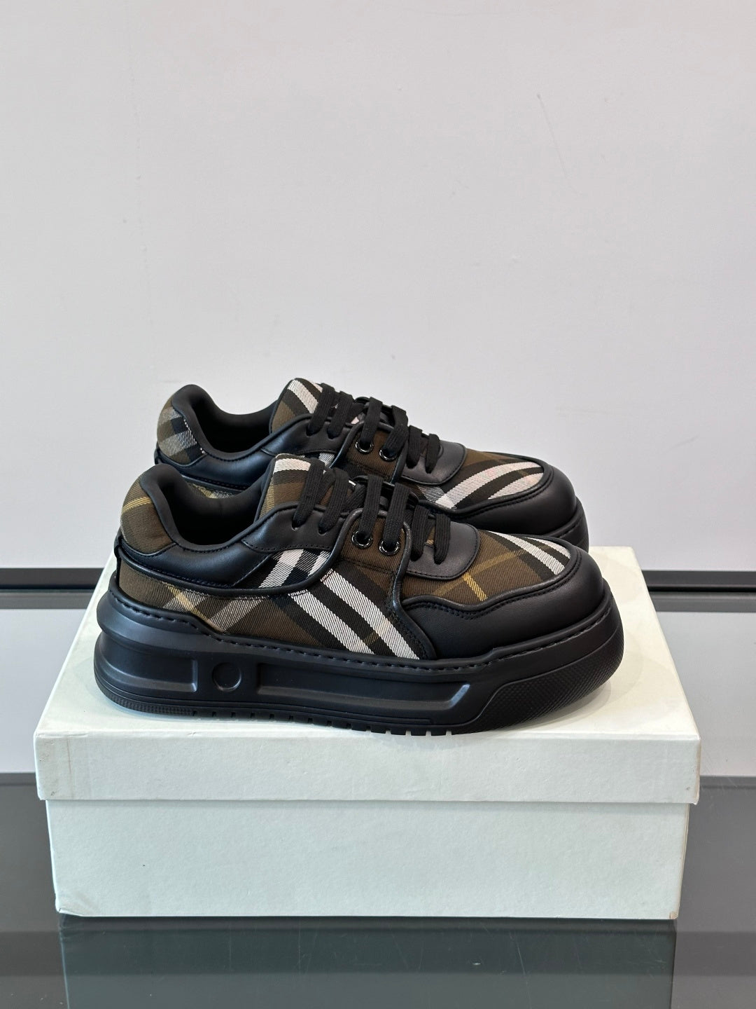 Chunky lace-up sneakers in dark navy and brown with beige plaid stripe detail
