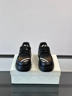 Pair of lace-up sneakers, dark navy with beige plaid and white stripe accents