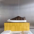 Fendi single low-top sneaker on box, brown FF-pattern upper, white rubber sole.