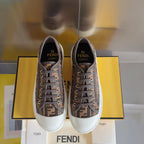 Unisex Fendi lace-up sneakers, brown FF pattern canvas, white sole and padded collar.