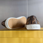 Fendi sneakers outsole view, white sole with logo, brown FF upper, heel and toe.