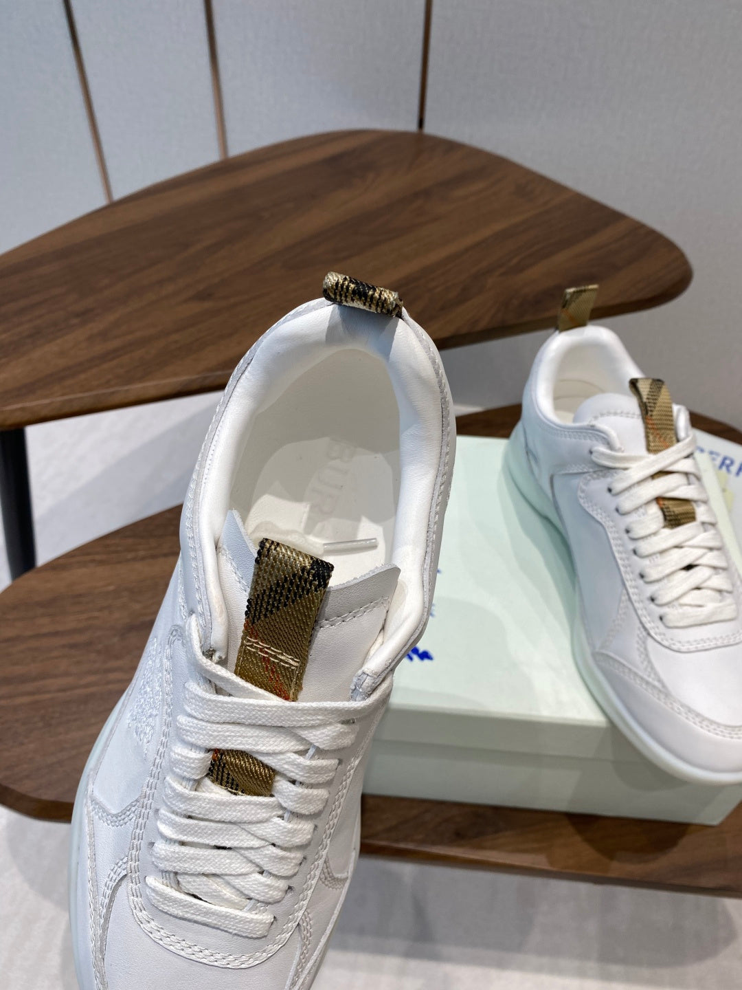 Burberry white leather sneakers with open collar, lace-up and gold-tone accents
