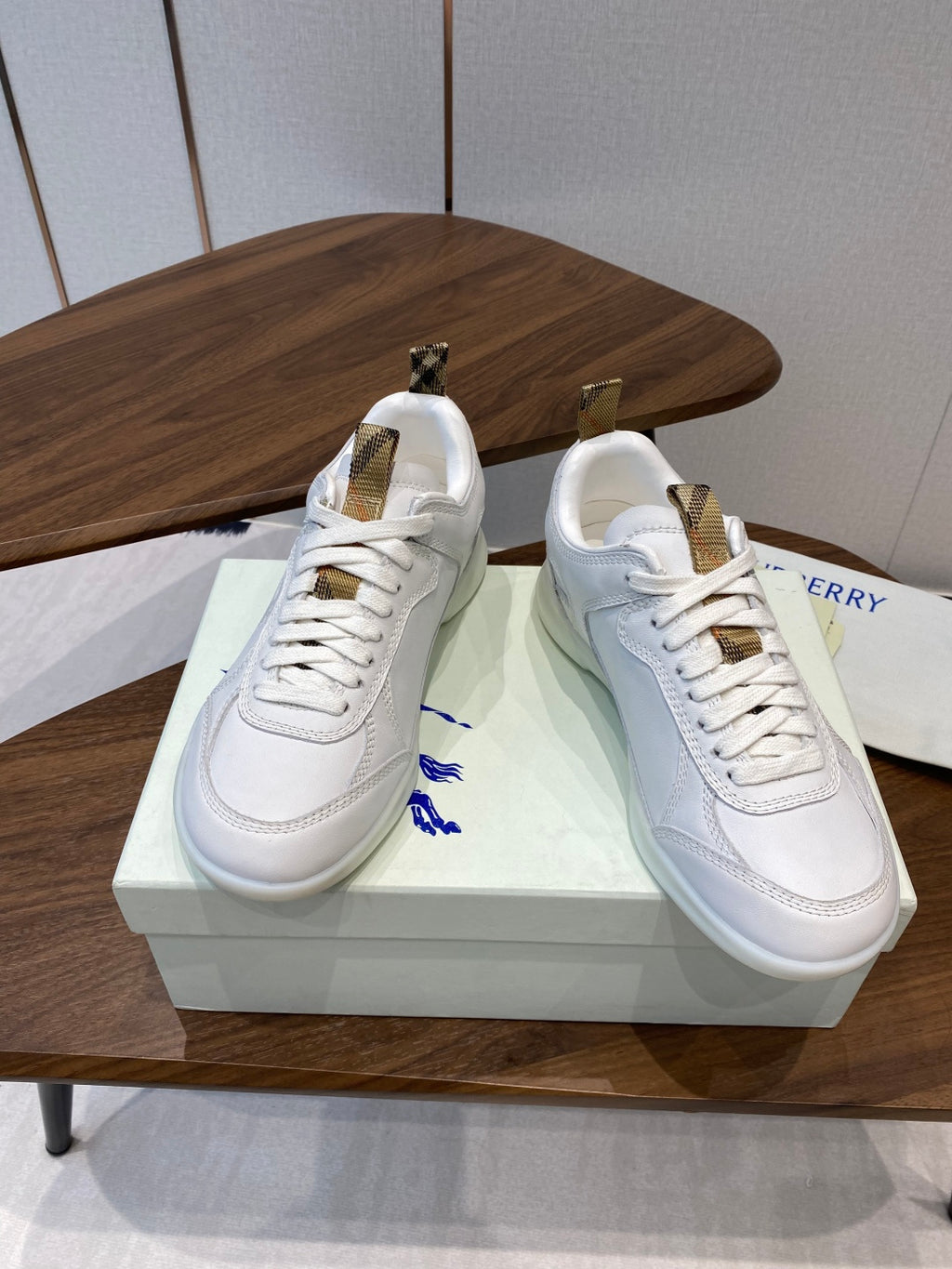 Burberry white leather sneakers on box, lace-up front with gold-tone heel tabs