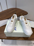 Burberry white leather sneakers on box, lace-up front with gold-tone heel tabs