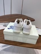 Burberry white leather sneakers back view, lace-up with gold-tone heel panels