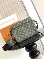 Olive green crossbody bag with white monogram pattern and top flap, black strap