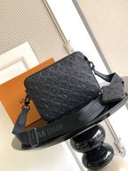 Monogram crossbody bag with front flap and crossbody strap, dark leather.