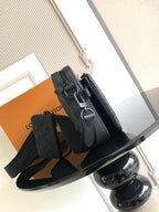 Monogram crossbody bag with top handle and adjustable strap, dark leather.
