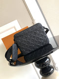 Monogram crossbody bag with shoulder strap, dark textured leather.