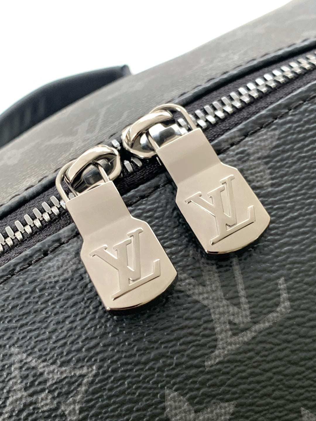Louis Vuitton monogram bag zipper pull with two LV padlock charms